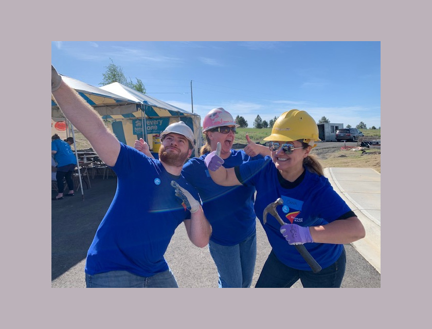 three Banner Bank volunteers smiling