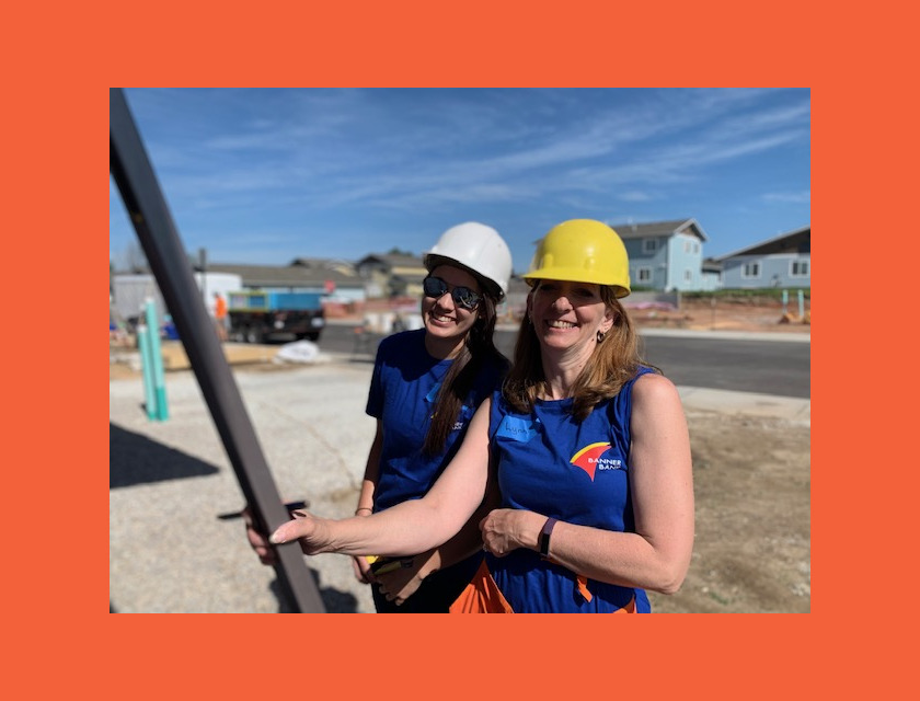Two female Banner Bank volunteers smiling