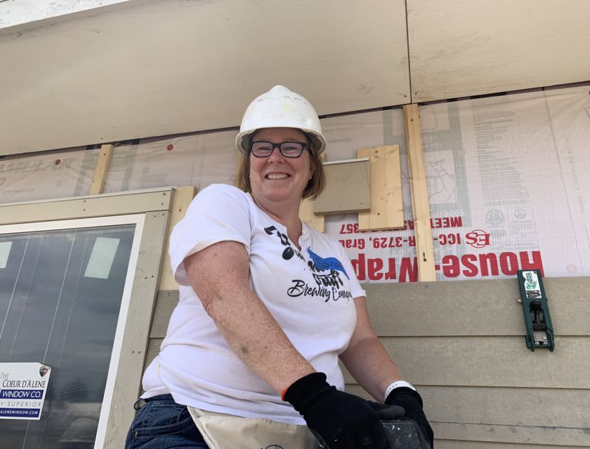 Female volunteer on ladder